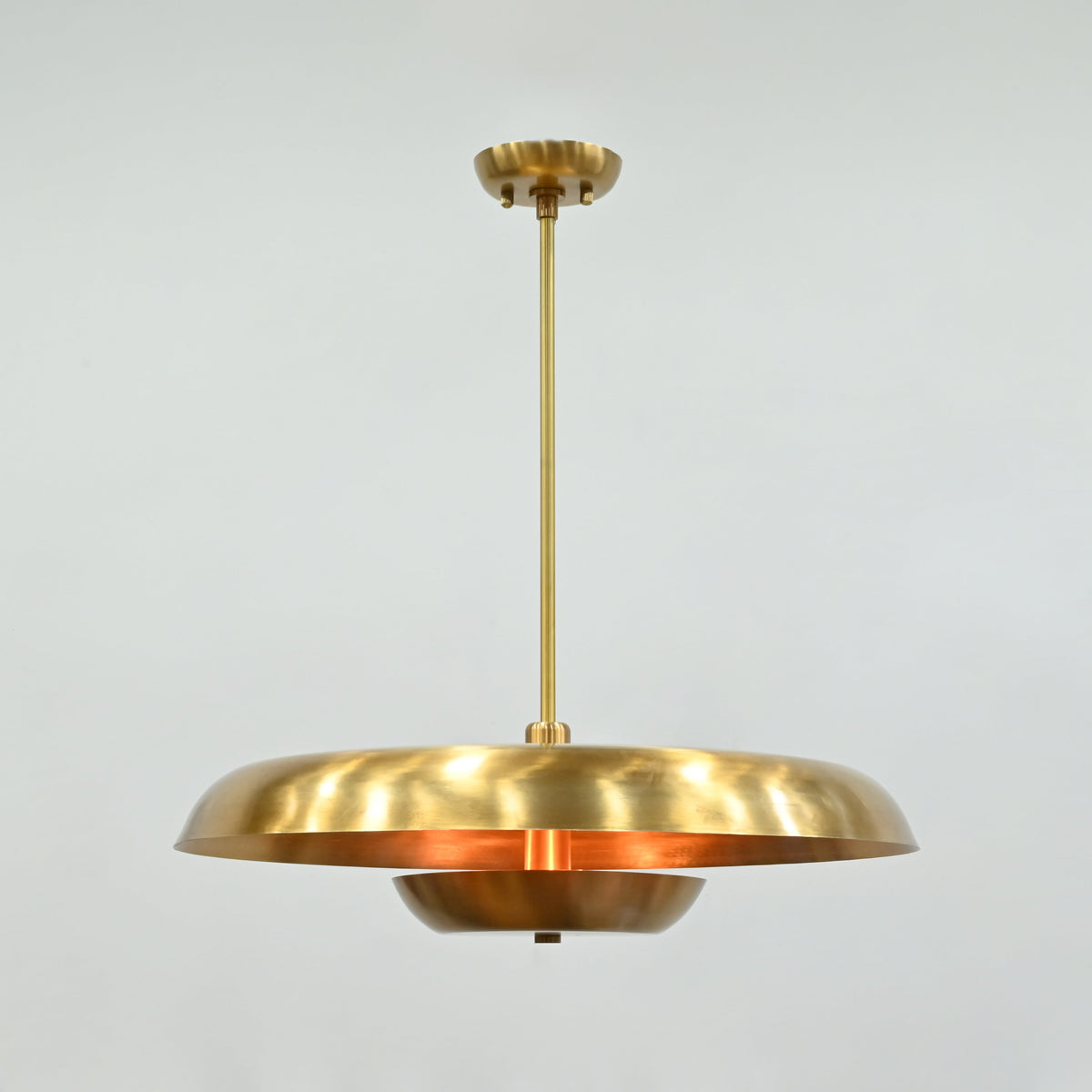 Solid brass layered pendant chandelier with wide upper disc and smaller lower bowl detail for statement lighting