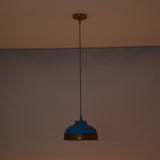Solid copper dome pendant light hanging above a bedroom with warm ambient lighting and decorative style