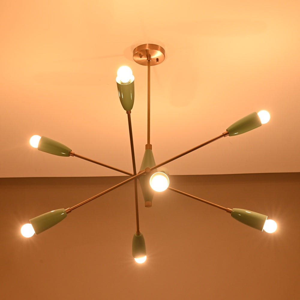 Warm-lit 8-light Sputnik chandelier in teal and brushed brass, creating soft ambient glow with mid-century cone shades.