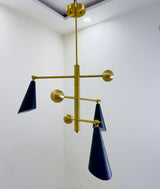 Modern ceiling-mounted three cone brass chandelier designed for ambient lighting in contemporary living spaces.