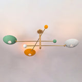 Bottom view of modern brass flush mount ceiling light highlighting multicolor bowl shade arrangement