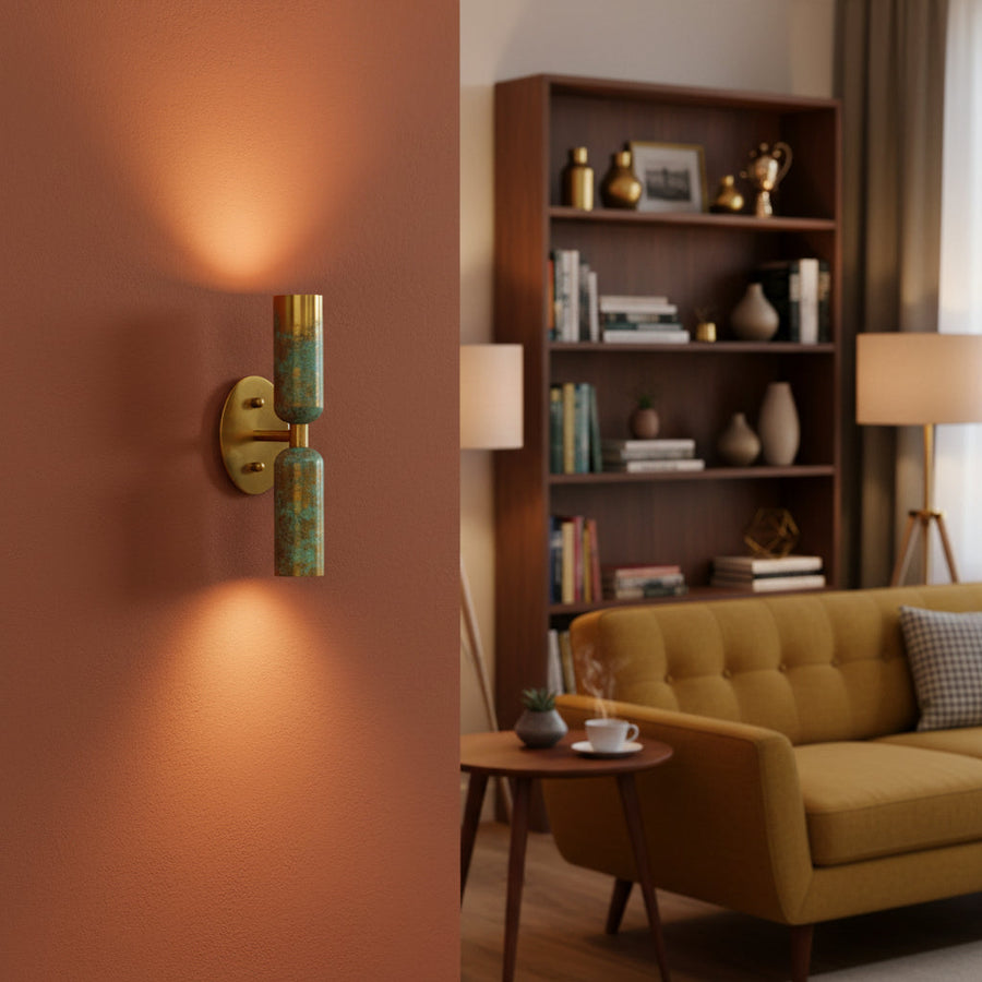 Solid brass dual shade wall sconce side view showing cylindrical shades, round canopy, and compact wall projection