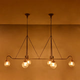 Warm ambient glass globe chandelier with ribbed shades, ideal for dining rooms, living rooms, and hospitality interiors