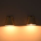 White and brass vanity wall lights with soft downward glow for bathroom mirrors and powder room styling
