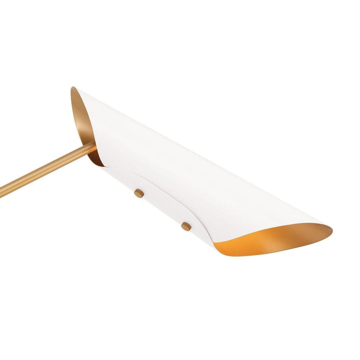 Close up of white brass cone shade with gold interior creating soft indirect ambient light