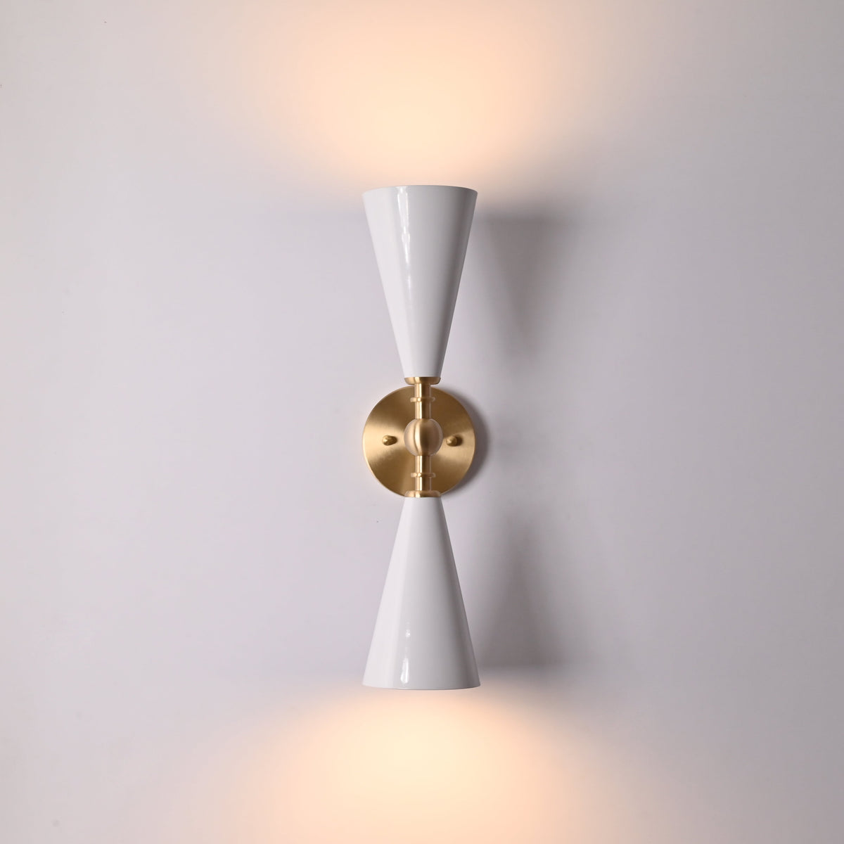 White enamel cone sconce creating warm downward glow for dining rooms, hallways, and bedrooms