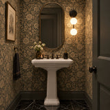 Zurich dual globe wall sconce installed inside an illuminated arched wall niche with warm decorative ambient lighting